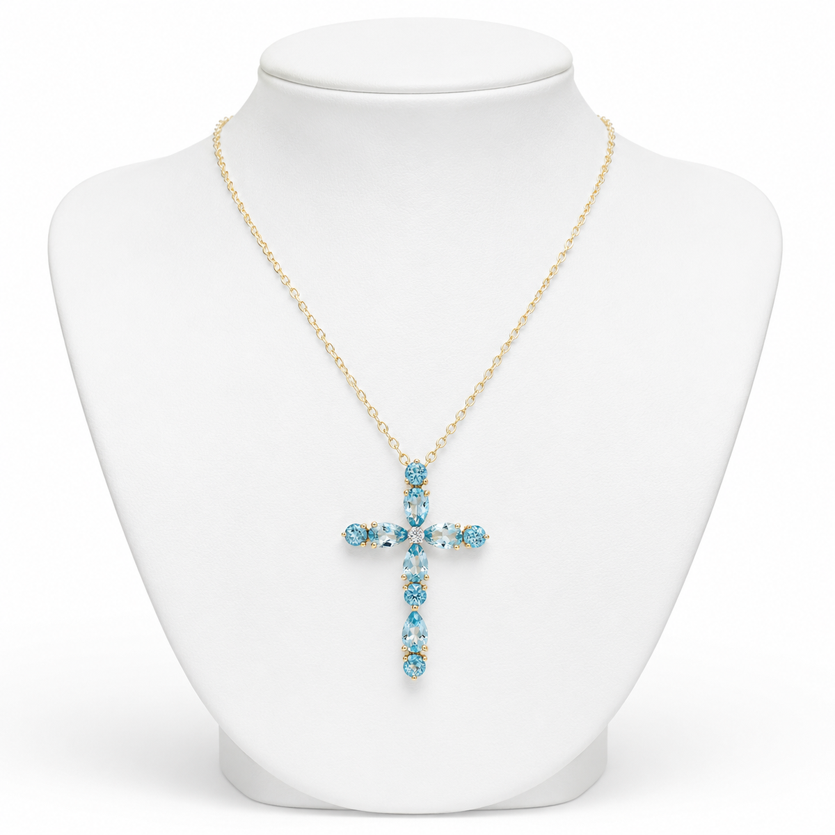 Collar cruz dorada con piedras azules