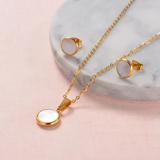 Conjunto dorado con nácar blanco