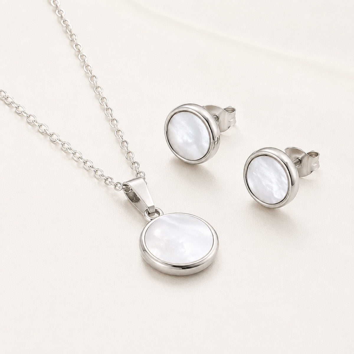 Conjunto plateado nácar circular